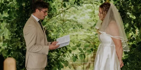 A man reading his vows