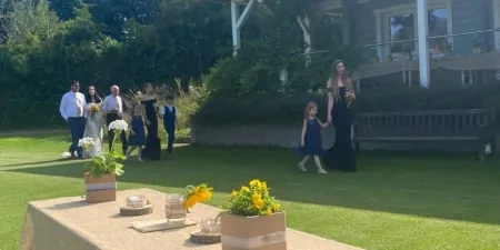 Family walking on grass