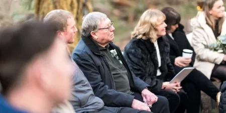Family listening to a ceremony