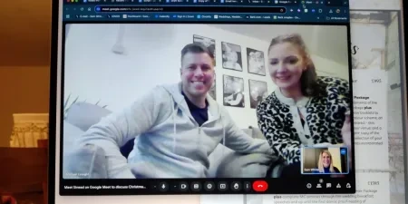 A man and woman on a laptop screen in a video call