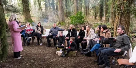 A woman addressing the guests 