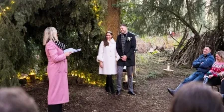 Sam White stood in a forest with Sinead and Michael
