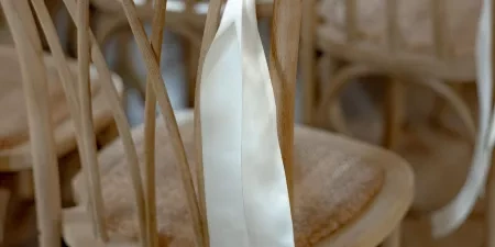 A close-up of a modern and elegant aisle ribbon in the ceremony room at Ivy Lodge in Circencester.
