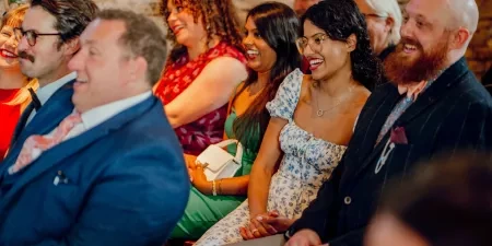 A photo of the guests at a wedding ceremony with Sam White Celebrant at Cripps Barn.