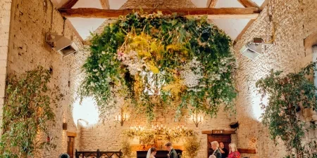 A photo of the guests at a wedding ceremony with Sam White Celebrant at Cripps Barn.