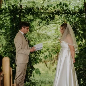 A man reading his vows