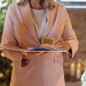 A woman holding a wedding ring box