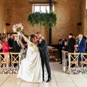 A photo of a couple kissing after their wedding ceremony at Old Gore Barn with Sam White Celebrant.
